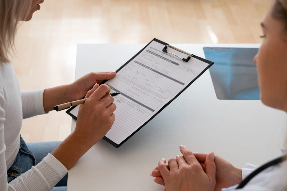 Patient completing a hair transplant clinic checklist with surgeon criteria, licensing and safety items