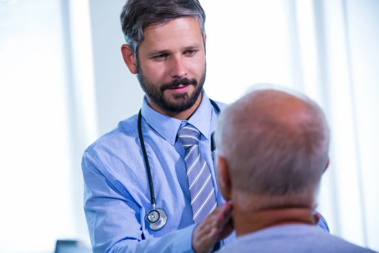 Doctor explaining hair transplant aftercare instructions to a patient after surgery